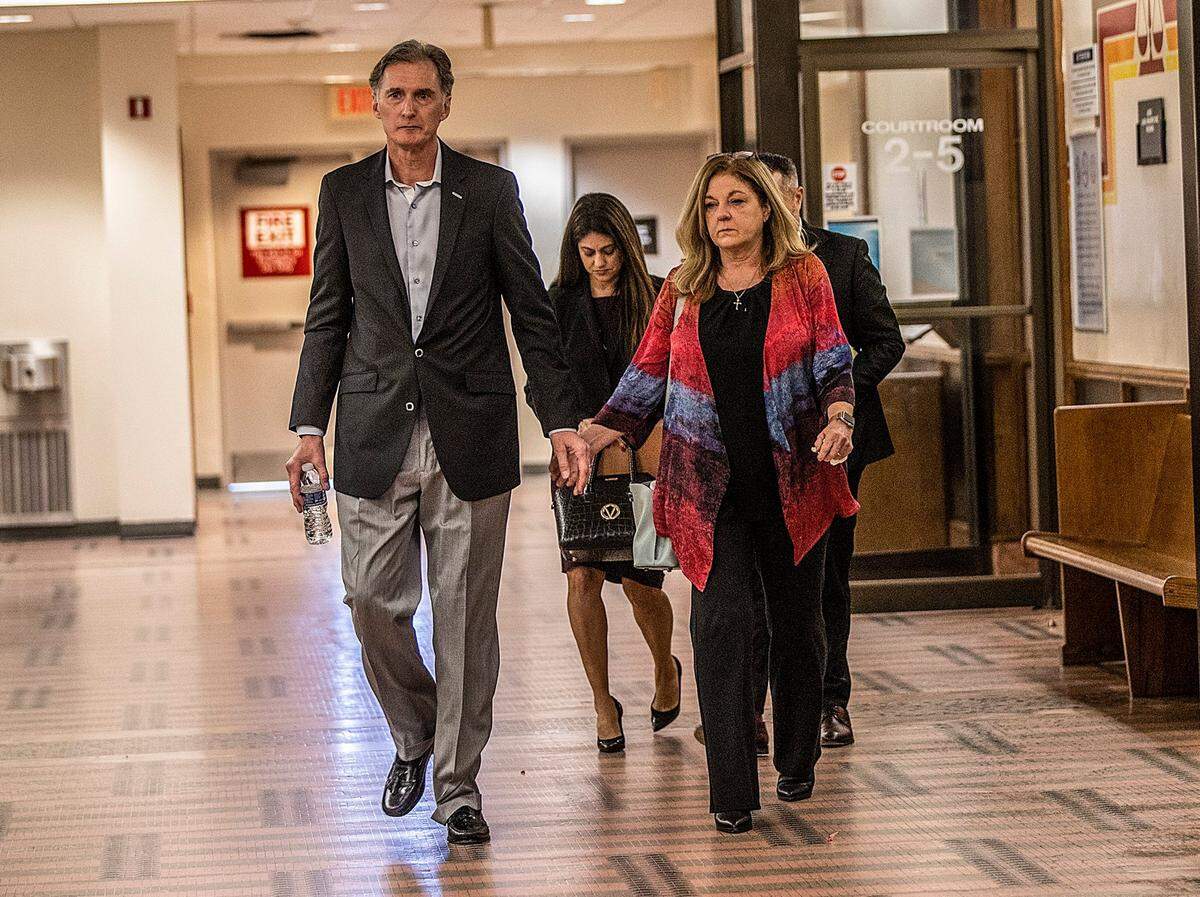 Deborah and Kim Clenney, the parents of OnlyFans model Courtney Clenney, walk out of the courtroom after the hearing in which Judge Laura Shearon Cruz denied her bond. She is accused of murdering her boyfriend Christian Obumseli in April 2022. The hearing took place at the Richard E. Gerstein Justice Building, in Miami, on Thursday, December 08, 2022.