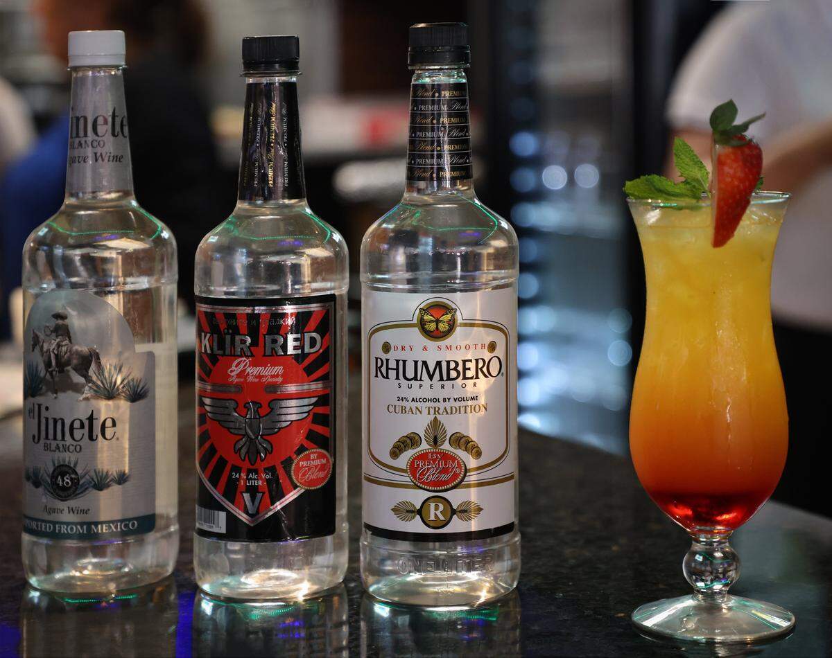 O. Gino Santos, president of Premium Blend, started a spirits business for beer and wine licensed restaurants and bars that can be used to make cocktail drinks like mojitos and other mixed drink cocktails. Pictured are variety of Premium Blend brands used to make cocktails.