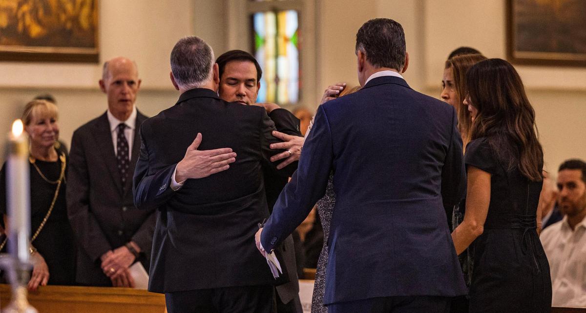 Secretary of State Marco Rubio hugs U.S. Congressman Mario Diaz-Balart during a service to honor the former U.S. Lincoln Diaz-Barlart as many gathered Saturday morning to remember and honor him the longtime South Florida congressman and fierce advocate for a free Cuba, who died at 70 after a battle with cancer, at the Corpus Christi Catholic Church, on Saturday March 08, 2025.