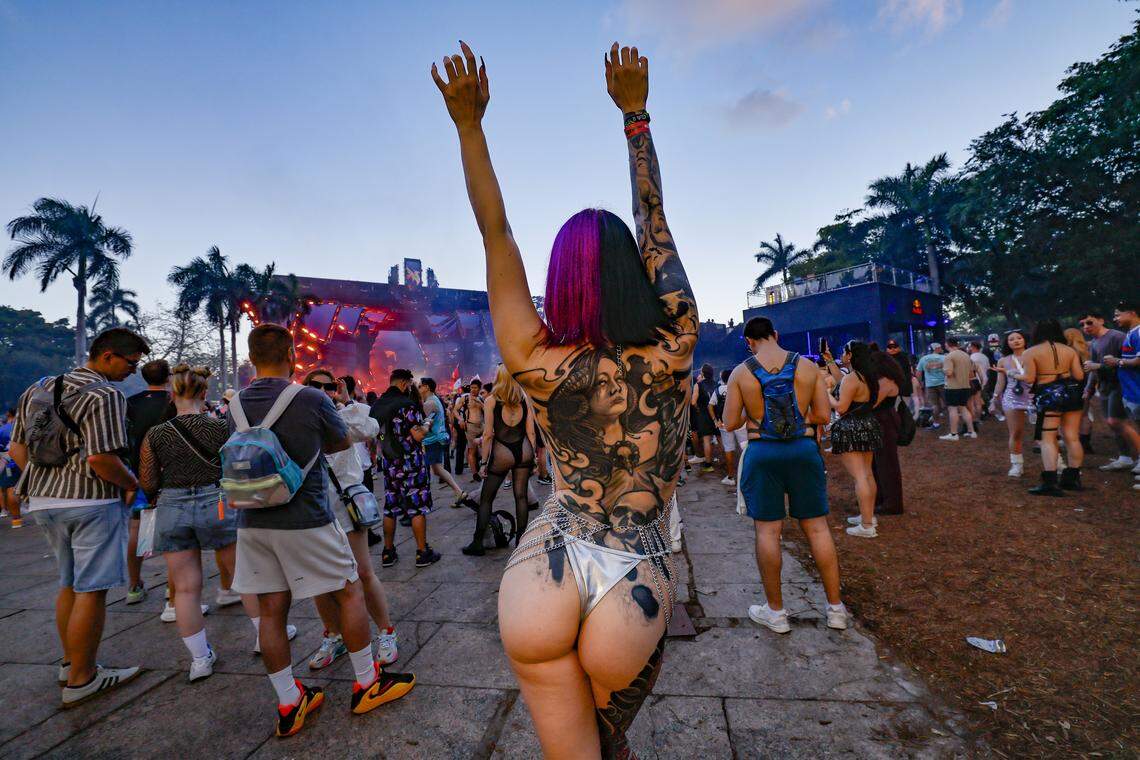 Shelby Dover of Colorado Springs shows off her tatoos at the Main Stage during Ultra Music Festival in Miami, Florida, on Friday, March 27, 2026.