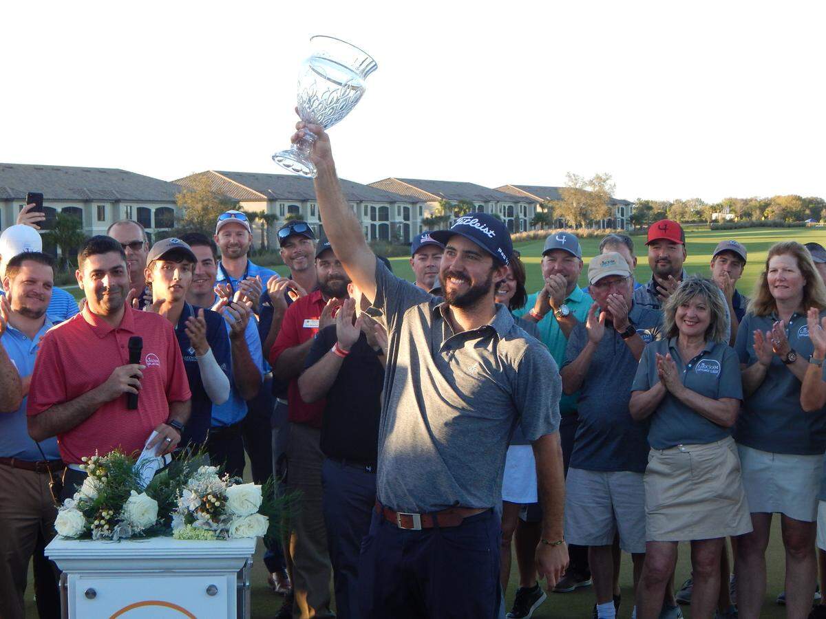 Denver native Mark Hubbard holds up the LECOM Suncoast Classic trophy after winning his first Web.com Tour event on Sunday at Lakewood National Golf Club. Hubbard shot 26-under-par 262 for the 72-hole tournament for a two-shot victory over former Stanford star Maverick McNealy.