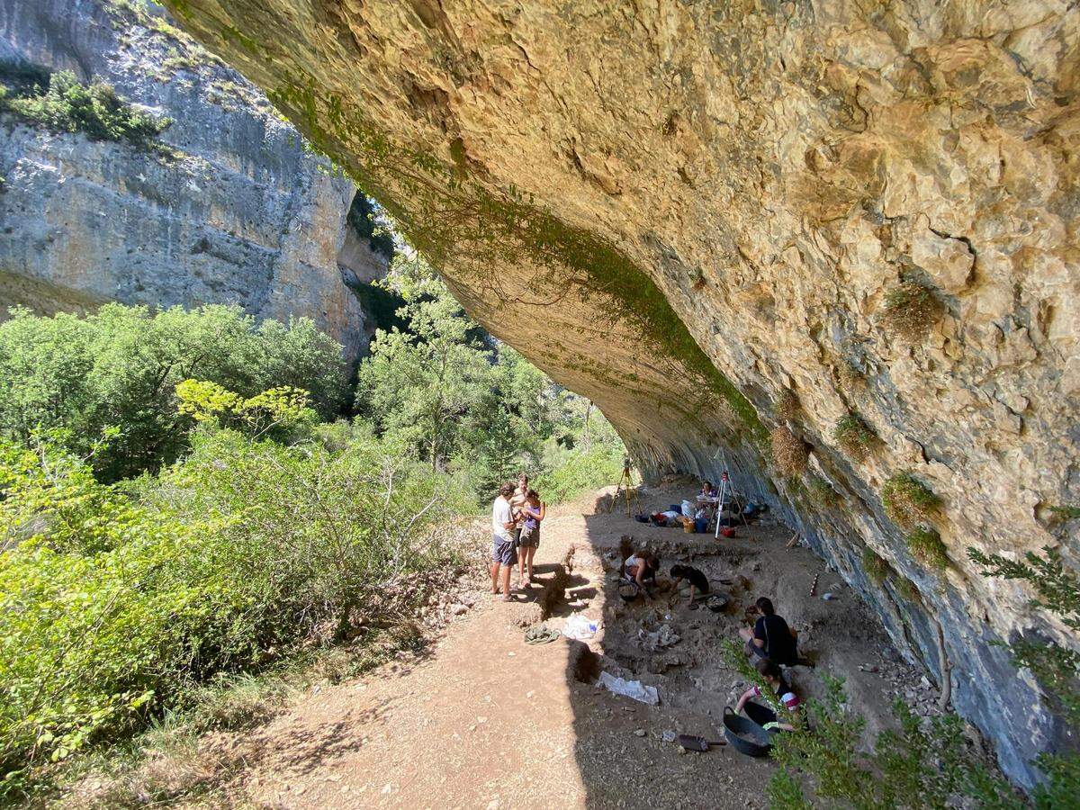 The shelter is found under a towering rock wall and likely provided refuge to seasonal travelers, researchers said.