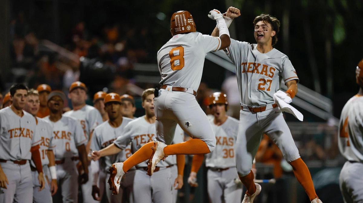 Texas Longhorns infielder Dylan Campbell (8) and Texas Longhorns infielder Jack O’Dowd (27) celebrate Campbell’s homer that brings in runner Texas Longhorns Jared Thomas (9) against the Miami Hurricanes during the first inning during Coral Gables Regional of the NCAA Division I Baseball Championship at Alex Rodriguez Park at Mark Light Field in Coral Gables on Saturday, June 3, 2023.