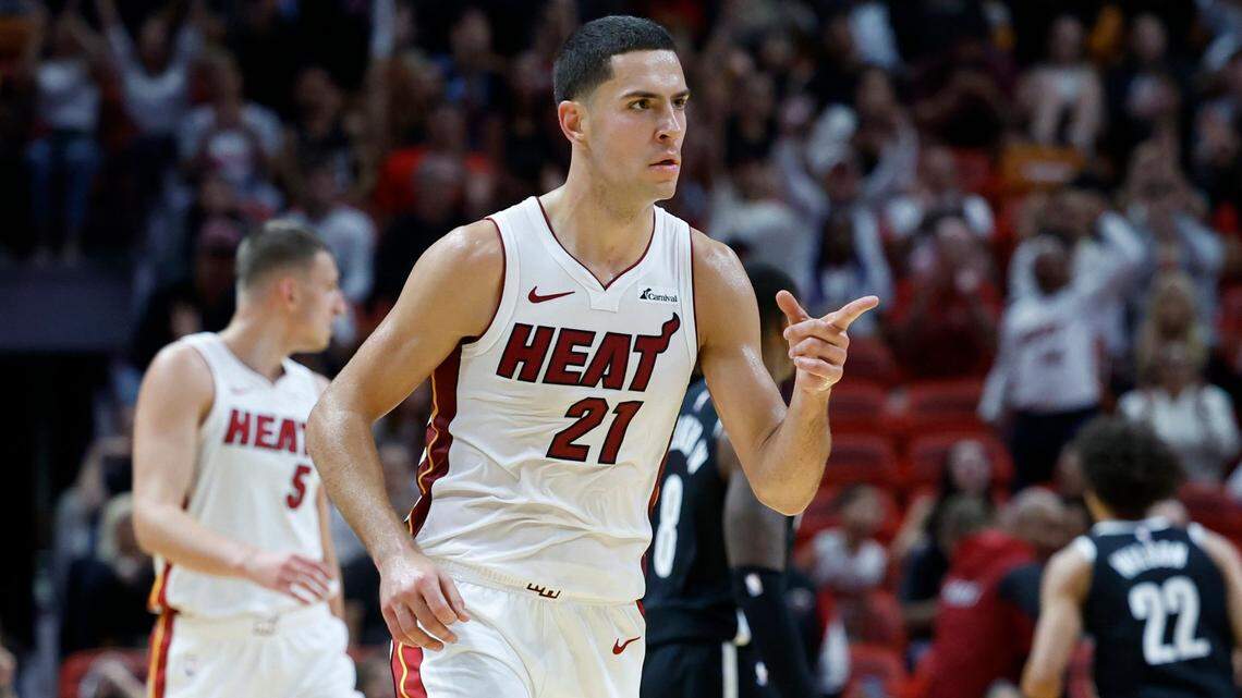 Miami Heat forward Cole Swider (21) reacts after hitting a three-pointer against the Brooklyn Nets in the fourth quarter at Kaseya Center in Miami on October 18, 2023.