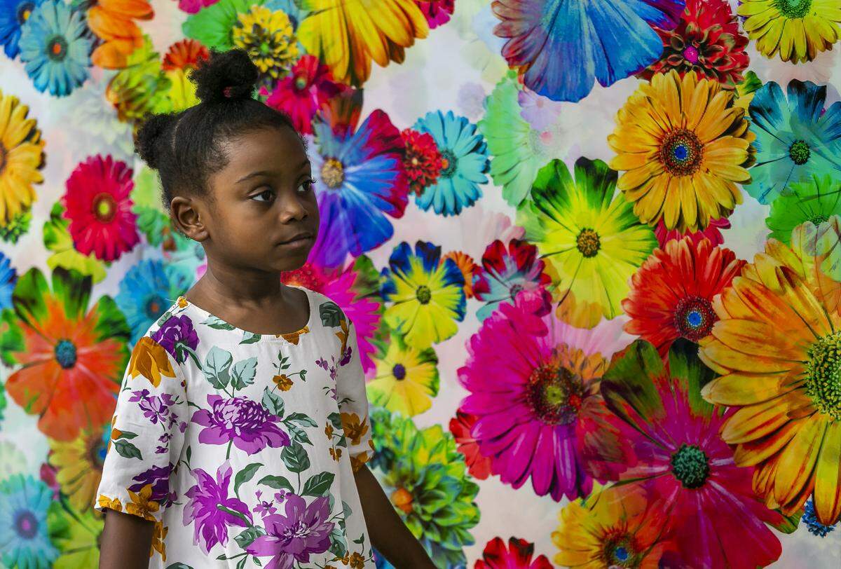 Lariel Ceac, 4, enjoys the work of artist Bruce Reinfeld at February’s Coconut Grove Arts Festival. The popular event has been canceled for 2021.