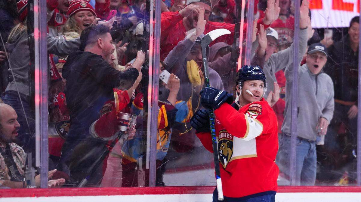 Jan 3, 2025; Sunrise, Florida, USA; Florida Panthers left wing Matthew Tkachuk (19) celebrates after scoring against the Pittsburgh Penguins during the third period at Amerant Bank Arena.