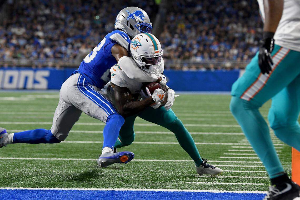 Aug 16, 2025; Detroit, Michigan, USA; Miami Dolphins wide receiver Dee Eskridge (82) scores a touchdown against the Detroit Lions in the first quarter at Ford Field. Mandatory Credit: Eamon Horwedel-Imagn Images