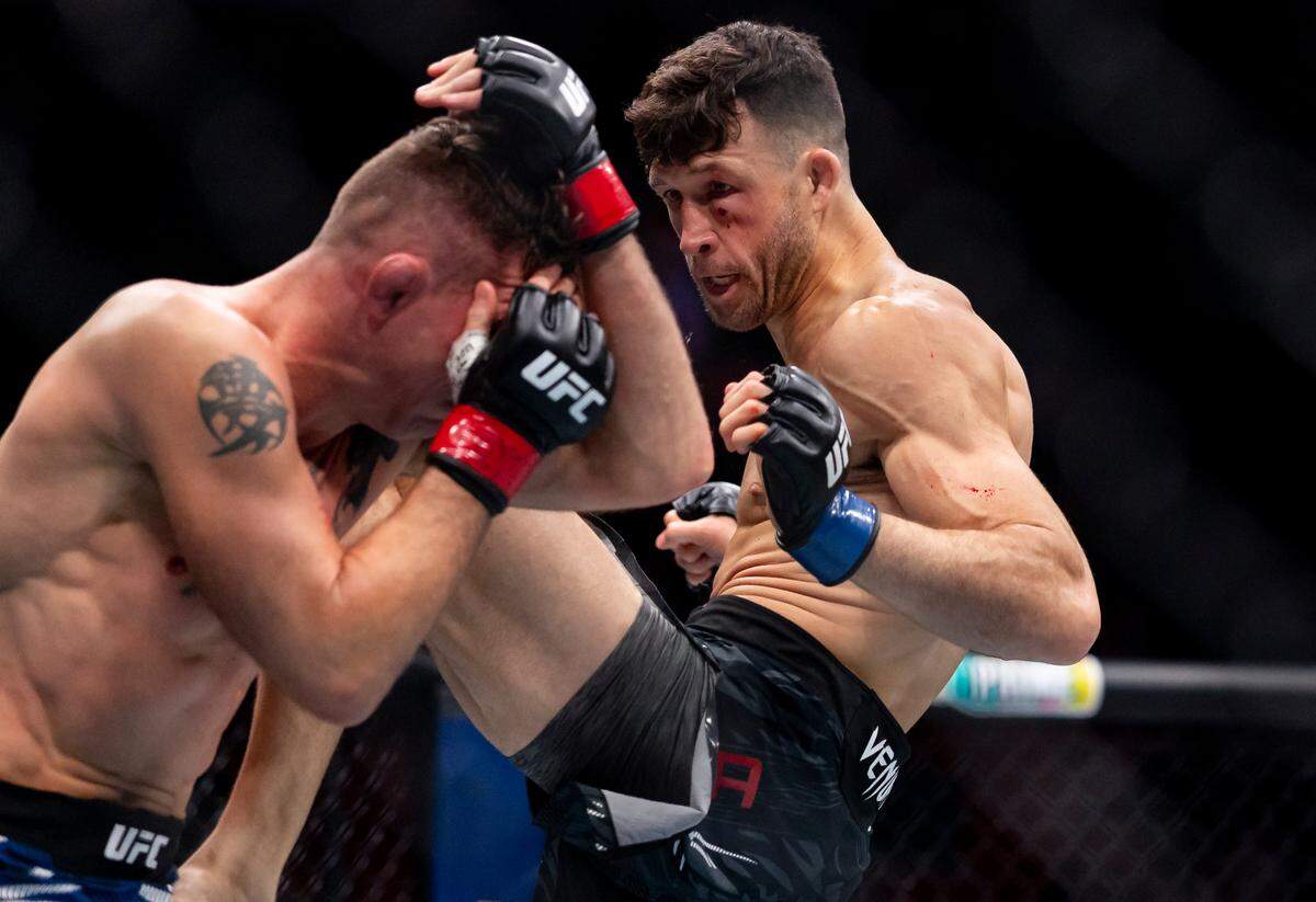 Julian Erosa of the United States fights against Darren Elkins of the United States during their featherweight bout during UFC 314 at the Kaseya Center on Saturday, April 12, 2025, in downtown Miami, Fla.
