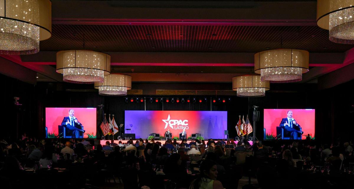 Eduardo Bolsonaro, Brazilian lawyer, activist and politician, speaks as CPAC Chairman & former White House political director Matt Schlapp listens during CPAC Latino 2025 at Seminole Hard Rock Hotel & Casino Hollywood, Florida, on Saturday, June 28, 2025.