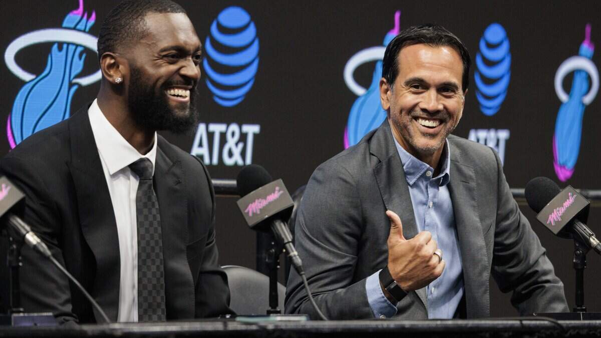 Head Coach Erik Spoelstra, right, recalls colliding with Bobby Portis (95) on the court during a press conference introducing Portis to the Miami Heat on Thursday, July 16, 2026, at the Kaseya Center in downtown Miami, Fla.