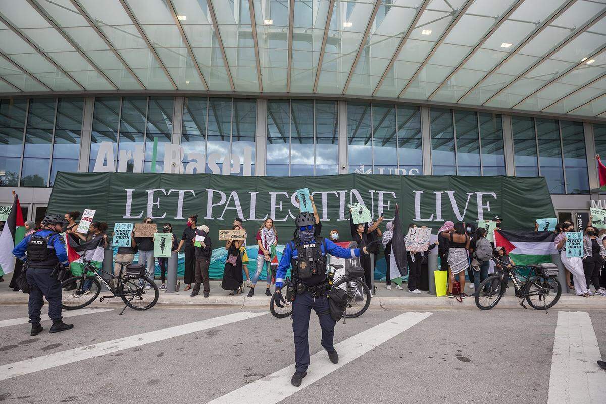 Artists and activists protest in front of Art Basel Miami Beach against the war in Gaza and because of Miami-Dade County’s recent investment in Israeli bonds on Dec. 8, 2023.