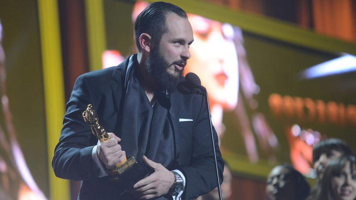 Porn impresario Greg Lansky receives an award at the 2016 Adult Video News awards in Las Vegas.