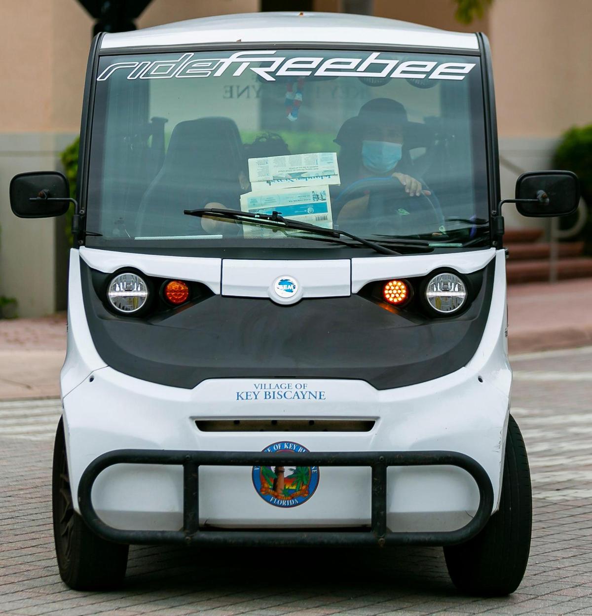 A Freebee transportation vehicle makes its way down Village Green Way in Key Biscayne, Florida on Tuesday, August 3, 2021.