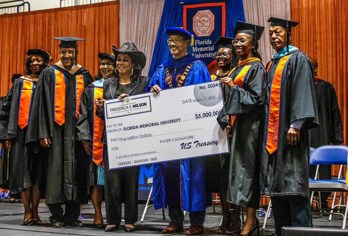 Congresswoman Frederica Wilson a $5 million check for the university during the Investiture Ceremony of Dr Jaffus Hardrick, Ed.D., as the 14th president of Florida Memorial University, celebrated at the University in Miami Gardens, on Friday March 17, 2023.