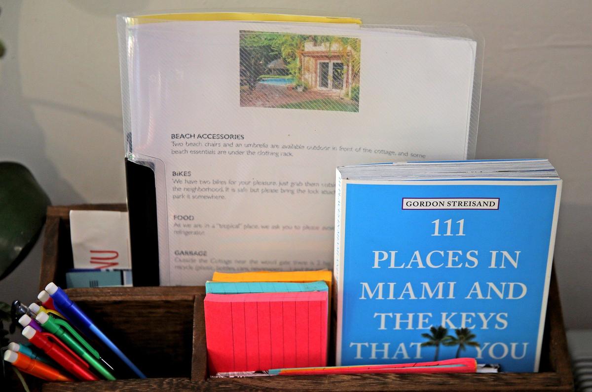 Paola Ugolini keeps books and guides in the Airbnb cottage at her home in Biscayne Park.