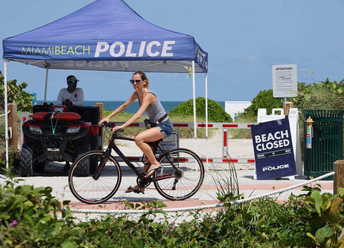 In April, Miami Beach police monitor the barricaded and crime-taped entrances on Fifth Street and Ocean Drive.