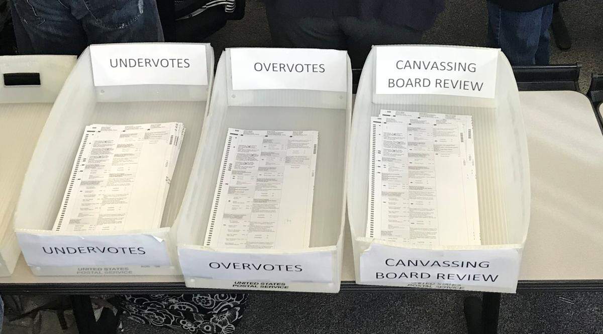 The bins from Counting Team No. 19, one of 20 Miami-Dade assembled to inspect more than 10,000 problematic ballots in the U.S. Senate race and more than 30,000 in the statewide race for agriculture commissioner.