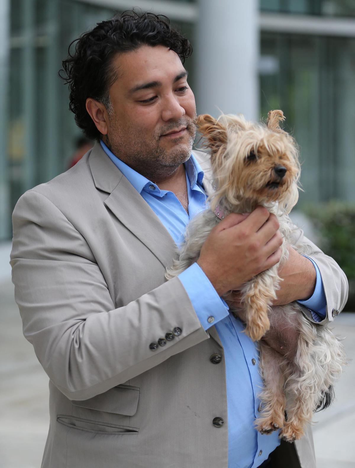 Ariel Jaimes and his Yorkie, Phoenix. He owns three dogs, and has had to find new places to walk them during the coronavirus pandemic while parks have been closed. He and other pet owners are overjoyed that dog parks will reopen Monday in the next phase of Miami-Dade County’s New Normal plan.