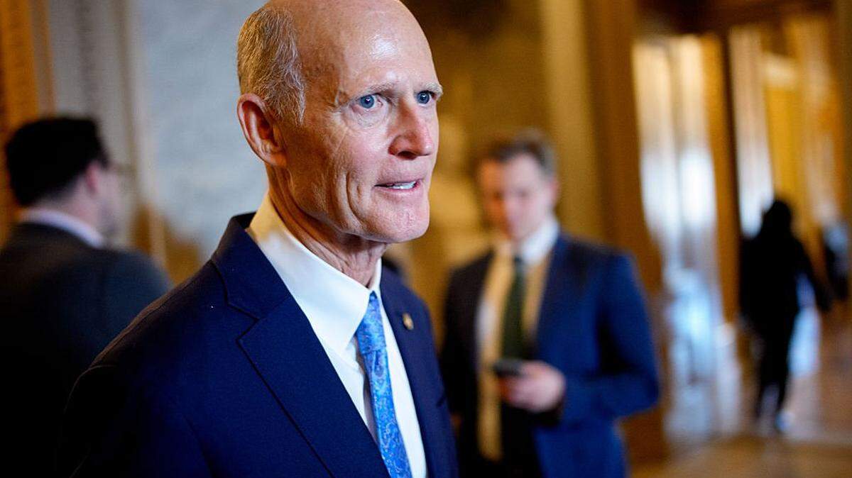 WASHINGTON, DC - DECEMBER 11: Sen. Rick Scott (R-FL) walks out of the Senate Chamber on December 11, 2025 in Washington, DC. Two opposing health care bills intended to avert rising health care premiums failed. (Photo by Andrew Harnik/Getty Images)