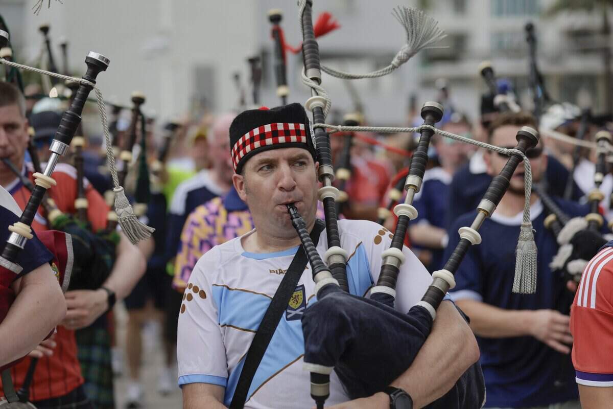 A Scottish bagpiper performs during the Tartan Army parade along Ocean Drive on Miami Beach on Tuesday, June 23, 2026.