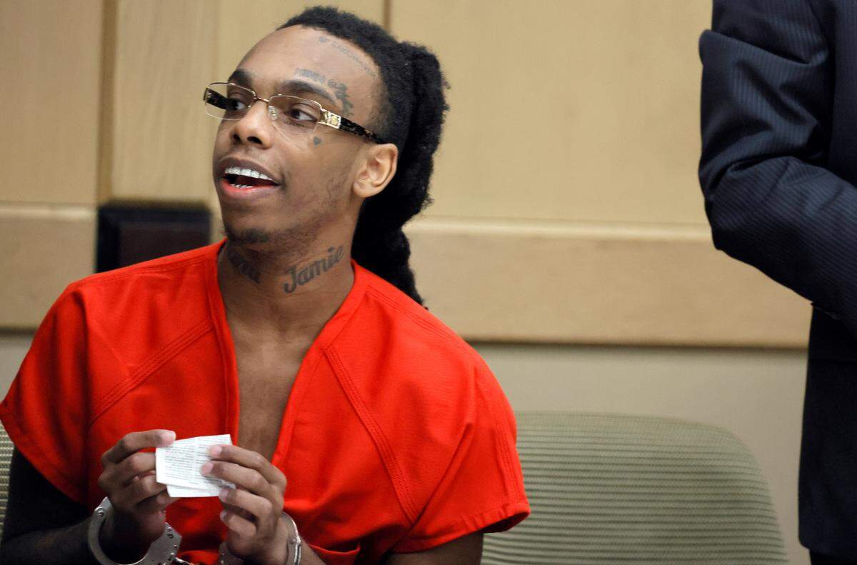 Jamell Demons, better known as rapper YNW Melly, speaks to someone in the courtroom gallery during a hearing in his trial at the Broward County Courthouse in Fort Lauderdale on Friday, Oct. 6, 2023. (Amy Beth Bennett / South Florida Sun Sentinel)