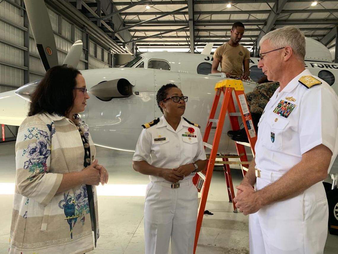 Jamaica Defense Force Coast Guard Commanding Officer Antonette Wemyss-Gorman, center, shows a new surveillance aircraft to Ambassador Jean E. Manes, Southcom foreign policy adviser and civilian deputy to the commander, and Southcom Commander Navy Adm. Craig Faller on Thursday, Nov. 7, 2019.
