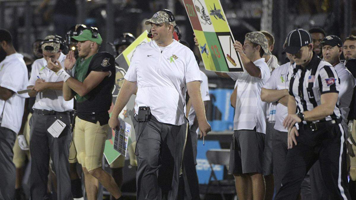 Central Florida head coach Josh Heupel, center, watches from the sideline during the second half of an NCAA college football game against SMU Saturday, Oct. 6, 2018, in Orlando, Fla.