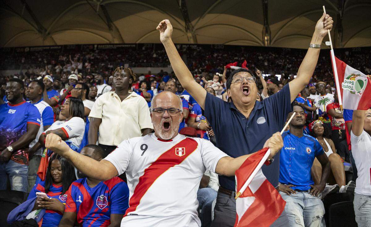 Peru fans cheer after their team scored against Peru in the second half of their friendly soccer match at Nu Stadium on Friday, June 5, 2026, in Miami, Fla.