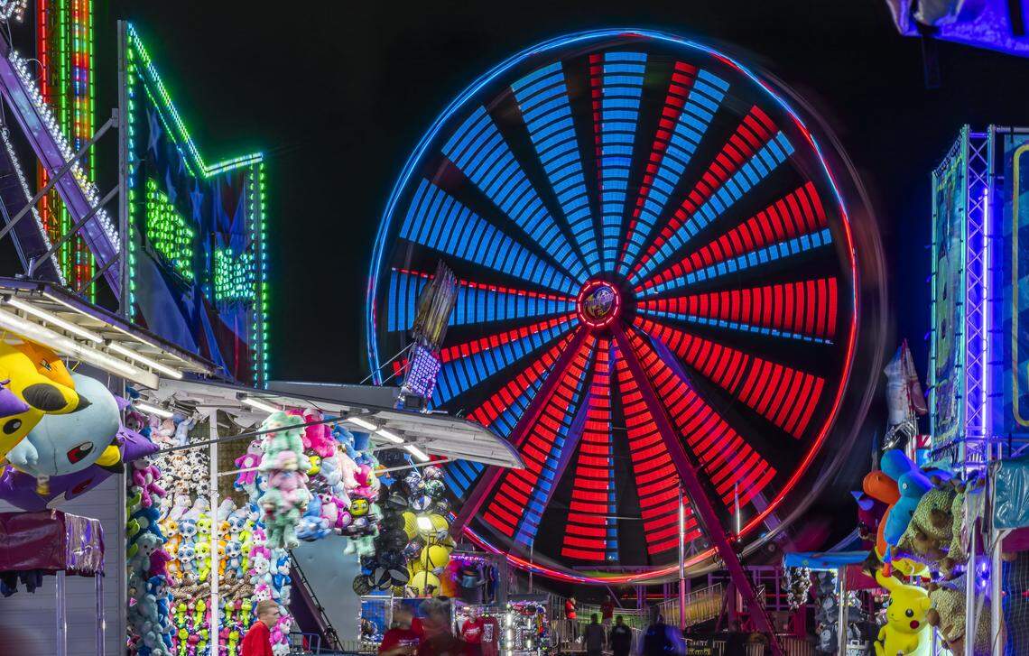 A ferris wheel attraction is operational during the grand opening of Ripley's Believe It or Not! Christmas Park at Amelia Earhart Park on Thursday, Nov. 13, 2025, in Hialeah, Fla.