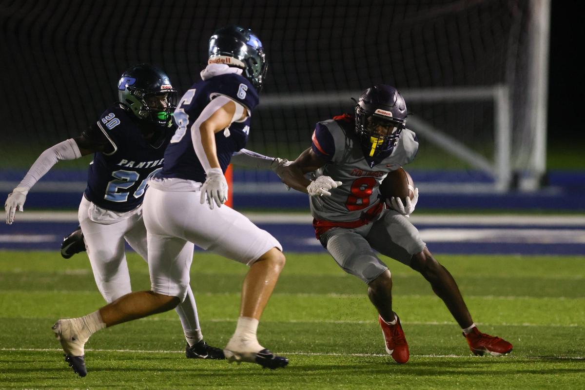 Columbus Explorers wide receiver Khamari Marceus (8) runs with the football against the Palmetto Panthers during the first quarter of a high school football game at Tropical Park Stadium in Miami, Florida, on Friday, September 13, 2024.