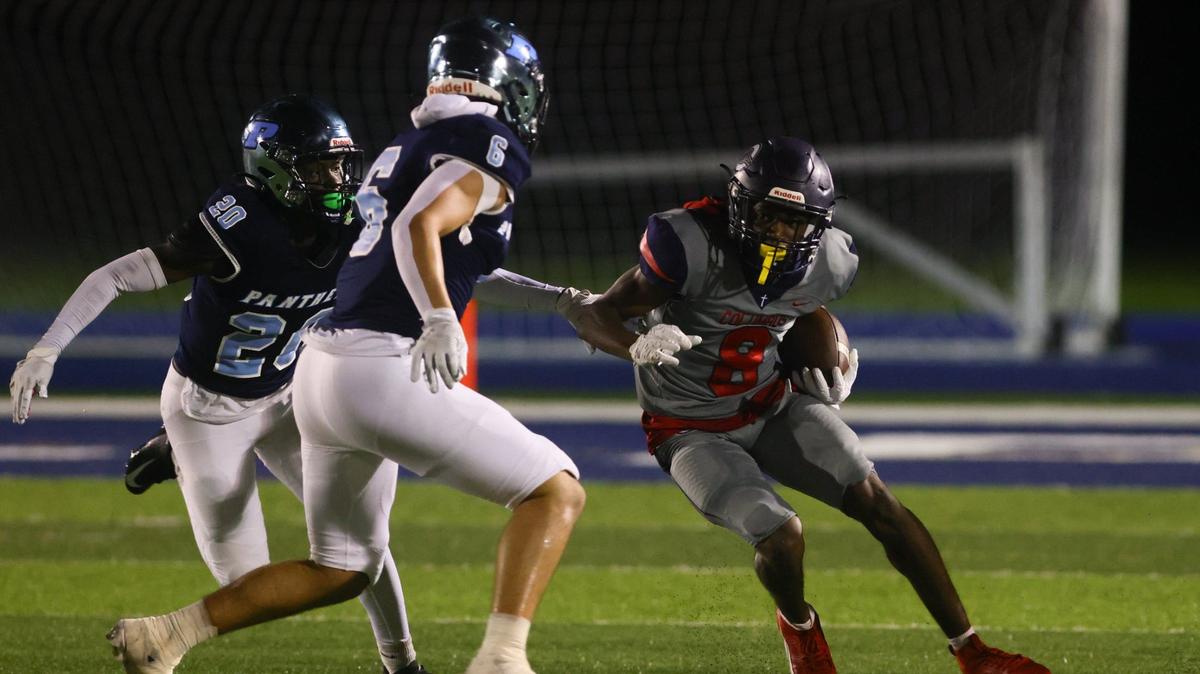 Columbus Explorers wide receiver Khamari Marceus (8) runs with the football against the Palmetto Panthers during the first quarter of a high school football game at Tropical Park Stadium in Miami, Florida, on Friday, September 13, 2024.