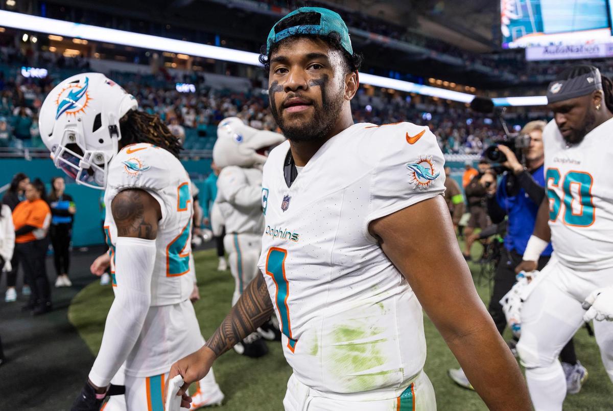 Miami Dolphins quarterback Tua Tagovailoa (1) walks off the field after losing his NFL game against the Buffalo Bills at Hard Rock Stadium on Sunday, Jan. 7, 2023, in Miami Gardens Fla.