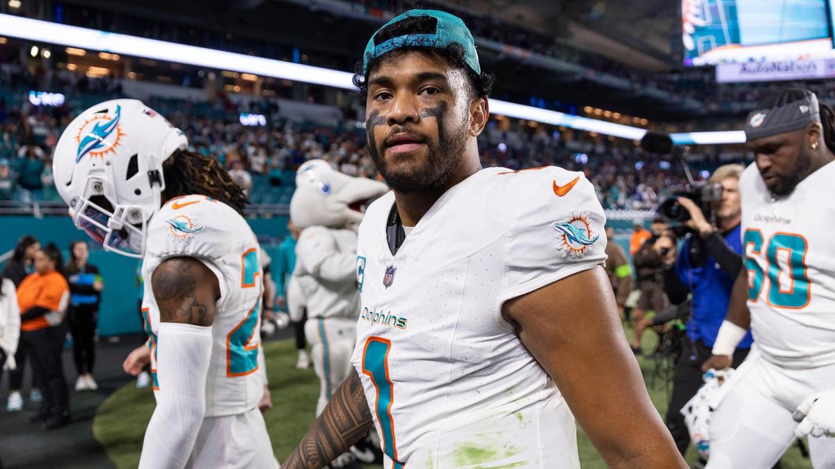 Miami Dolphins quarterback Tua Tagovailoa (1) walks off the field after losing his NFL game against the Buffalo Bills at Hard Rock Stadium on Sunday, Jan. 7, 2023, in Miami Gardens Fla.