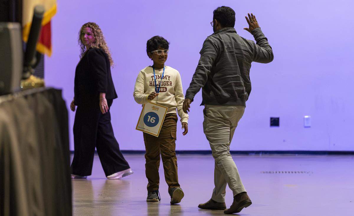 Ronak Tirunagari, fourth grader from Pembroke Pines Charter Elementary School - West, is consoled by his father, Vamsee Tirunagari, after misspelling a word in the 86th Miami Herald Spelling Bee for Broward County at the Charles F. Dodge City Center on Wednesday, Feb. 25, 2026, in Pembroke Pines, Fla.
