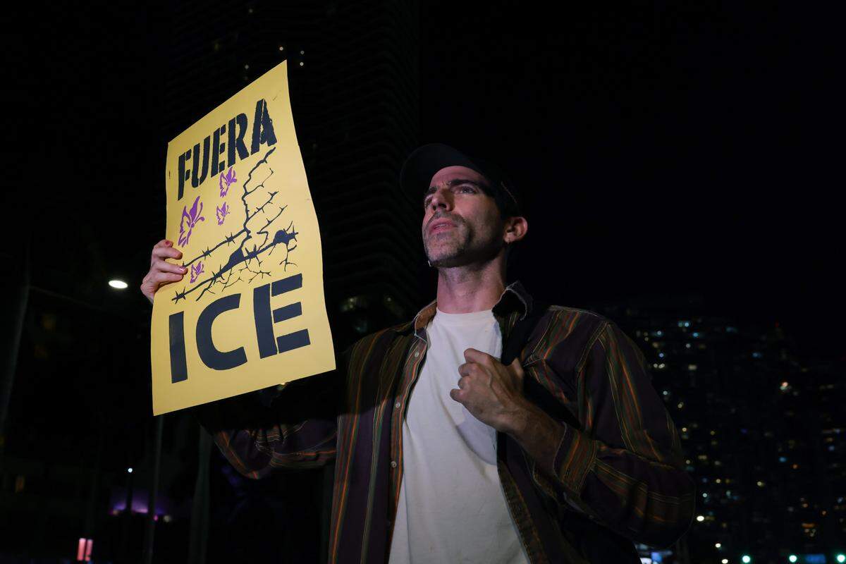 Misael Soto protests against ICE at the Torch of Friendship monument at 401 Biscayne Blvd., in downtown on Wednesday, Jan. 7, 2026, in Miami.
