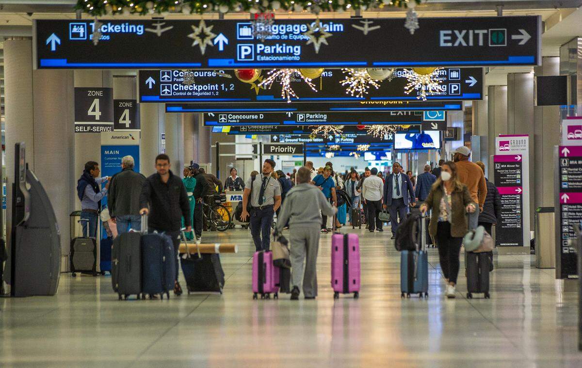 Travelers at MIA on Wednesday December 20, 2023.