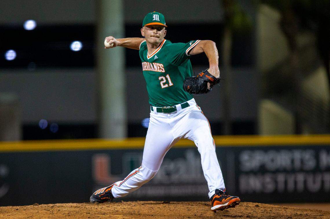 University of Miami pitcher Andrew Walters (21) throws the ball during the ninth inning of an NCAA baseball game against Towson University inside Alex Rodriguez Park at Mark Light Field in Coral Gables, Florida, on Friday, February 18, 2022.