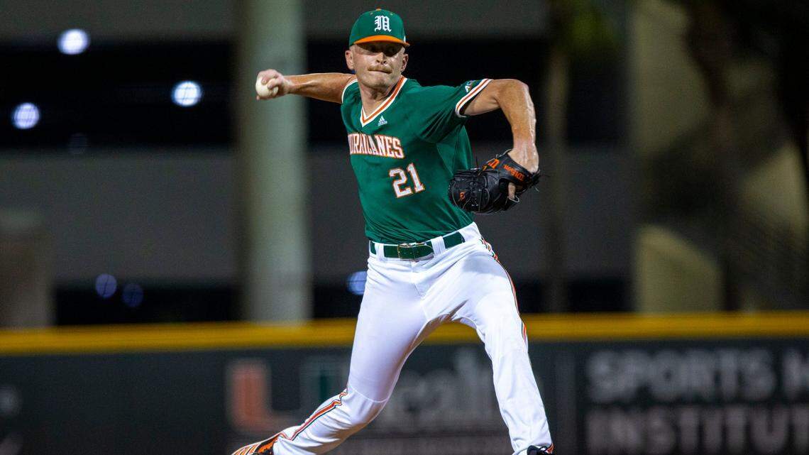 University of Miami pitcher Andrew Walters (21) throws the ball during the ninth inning of an NCAA baseball game against Towson University inside Alex Rodriguez Park at Mark Light Field in Coral Gables, Florida, on Friday, February 18, 2022.