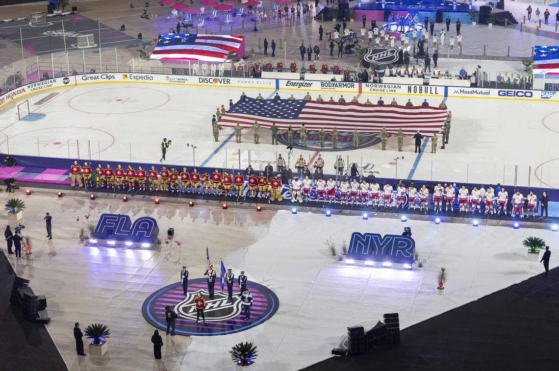 The Florida Panthers and the New York Rangers line up during the opening ceremony of their Winter Classic outdoor hockey game at loanDepot park on Friday, Jan. 2, 2026, in Miami, Fla.