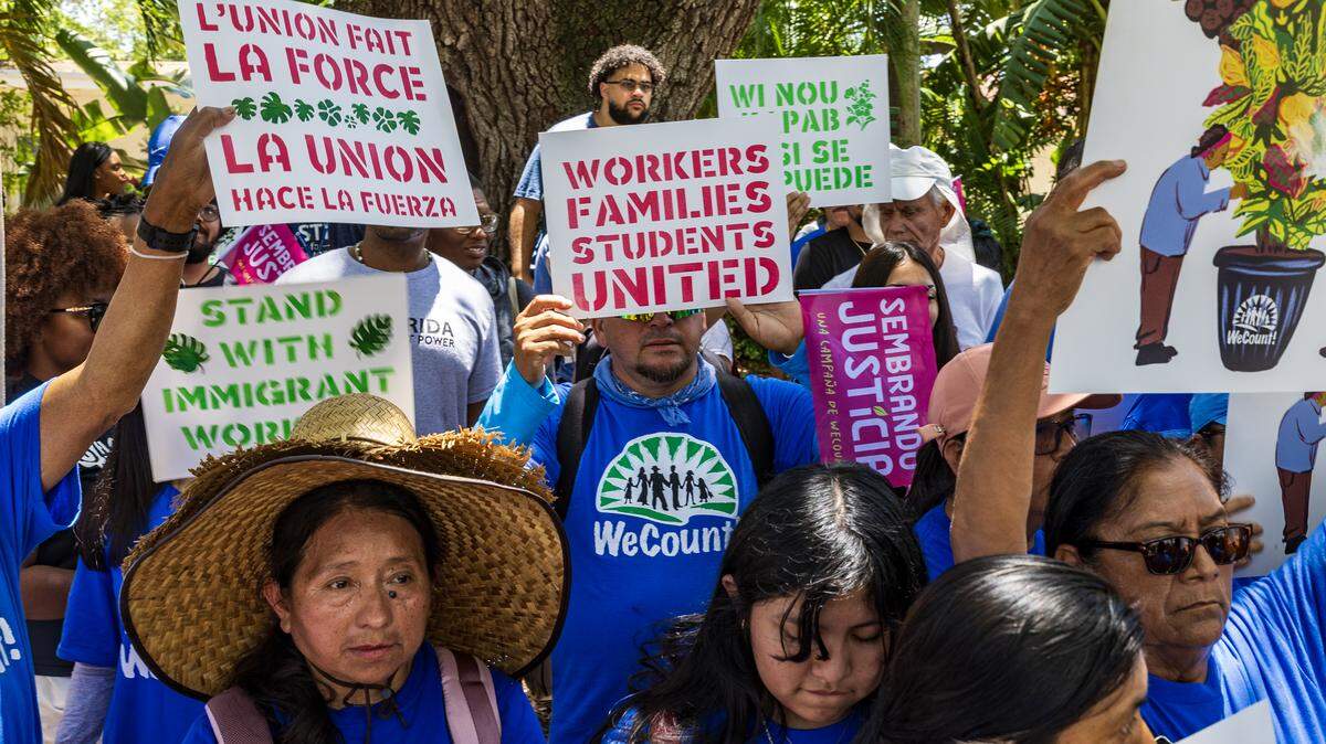 Hundreds of demonstrators marched two miles through Coral Gables on Friday to call attention to labor abuses in Florida’s plant nursery industry.