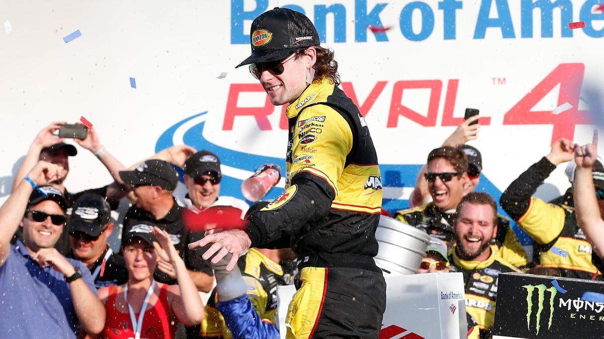 Ryan Blaney, driver of the #12 Menards/Pennzoil Ford, celebrates in victory lane after winning the Monster Energy NASCAR Cup Series Bank of America Roval 400 at Charlotte Motor Speedway on Sept. 30, 2018 in Charlotte, North Carolina.