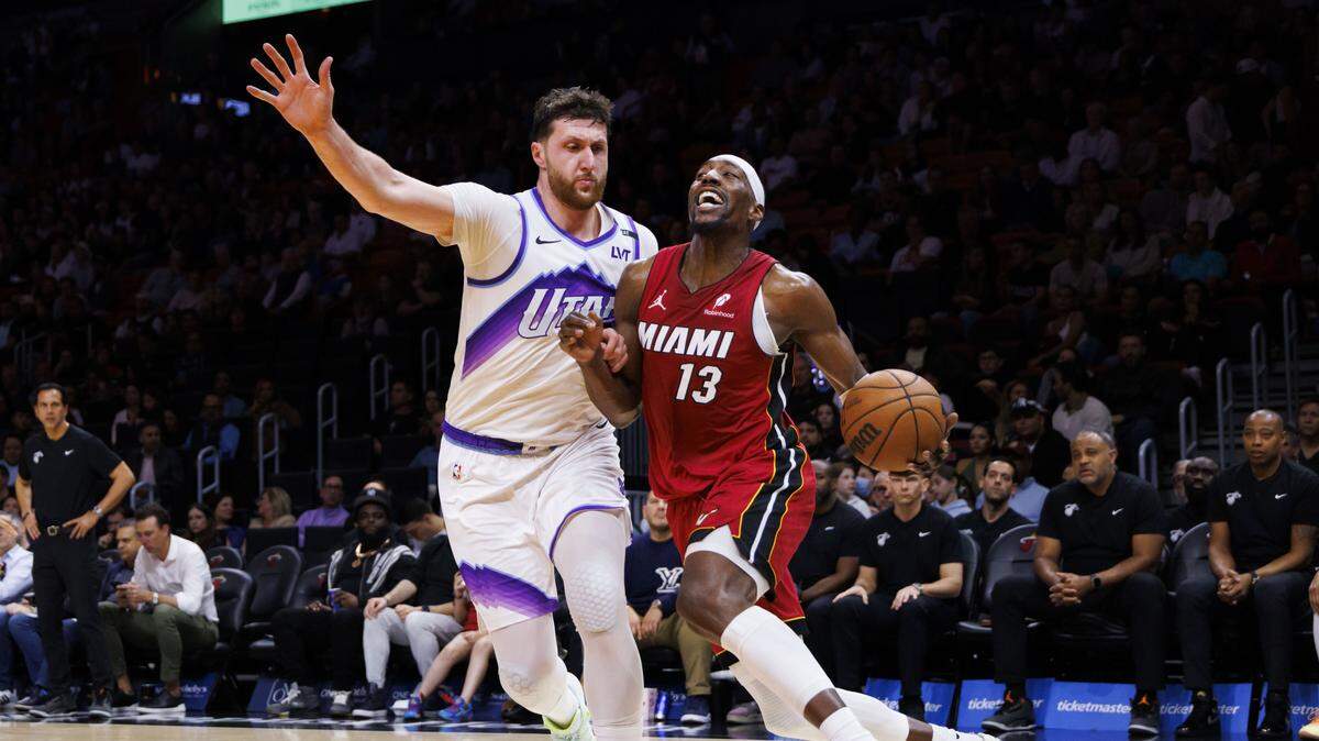 Miami Heat center Bam Adebayo (13) drives around Utah Jazz center Jusuf Nurkic (30) during the second half of a game on Feb. 9, 2026, at Kaseya Center in Miami.