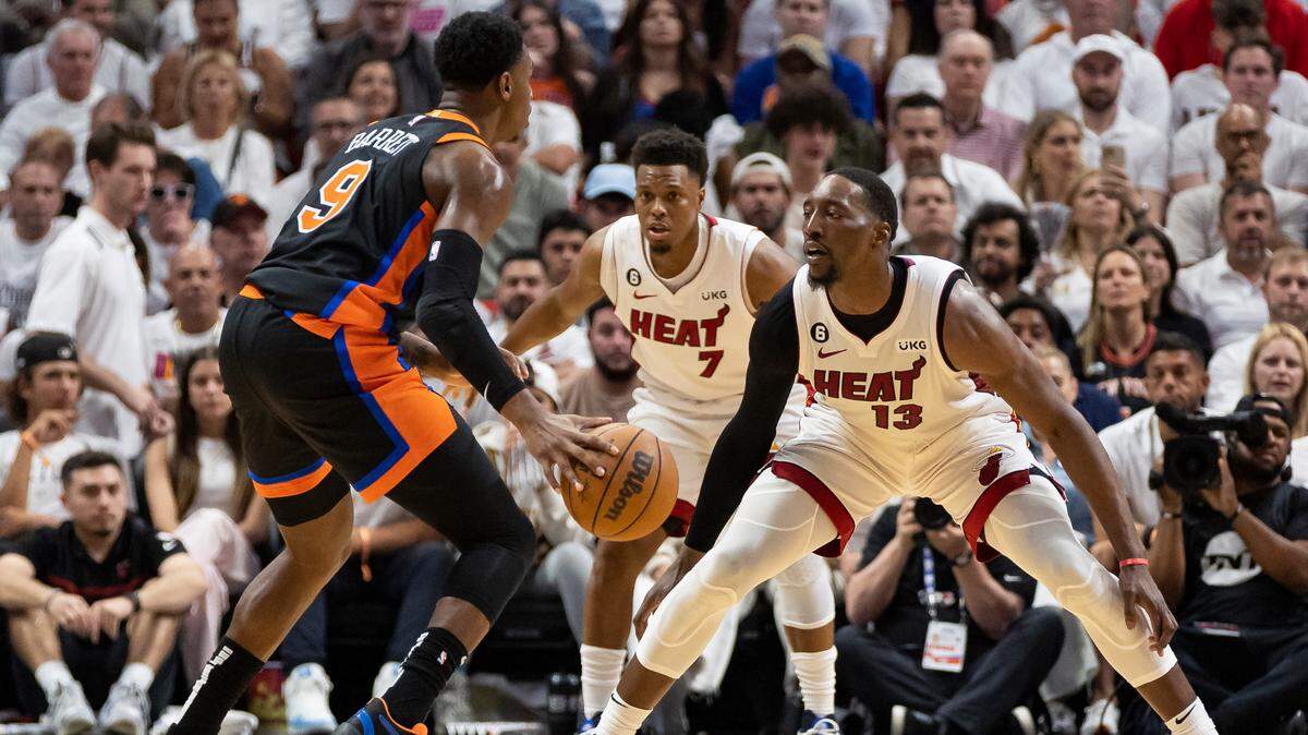 Miami Heat center Bam Adebayo (13) and guard Kyle Lowry (7) defend against New York Knicks guard RJ Barrett (9) in the second quarter of Game 4 of the NBA Eastern Conference Semifinals at the Kaseya Center in Miami on Monday, May 8, 2023.
