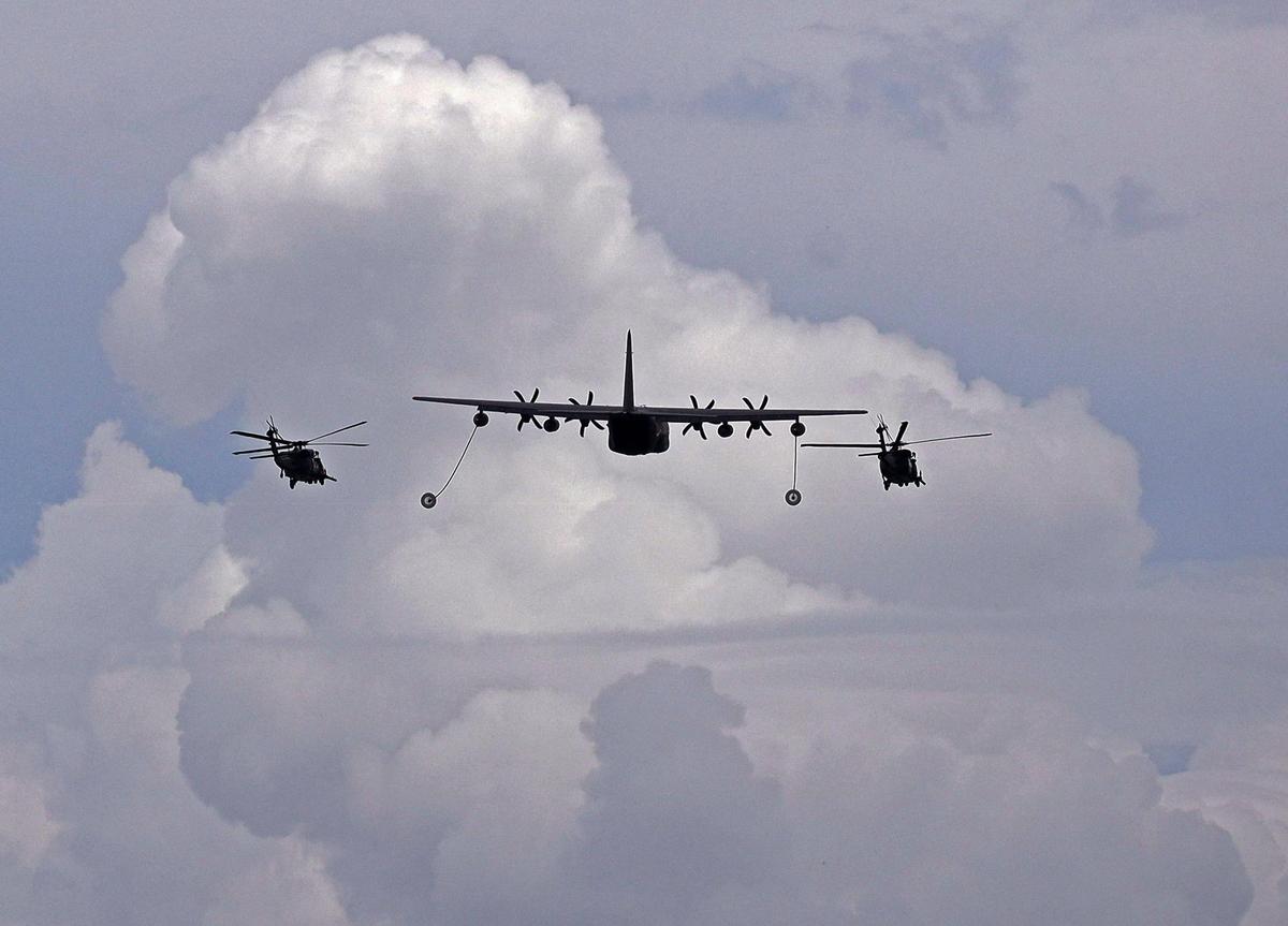 Fuel tanker demonstrate in-air fueling of two helicopters during the Hyundai Air and Sea Show over Miami Beach on Sunday, May 29, 2022.