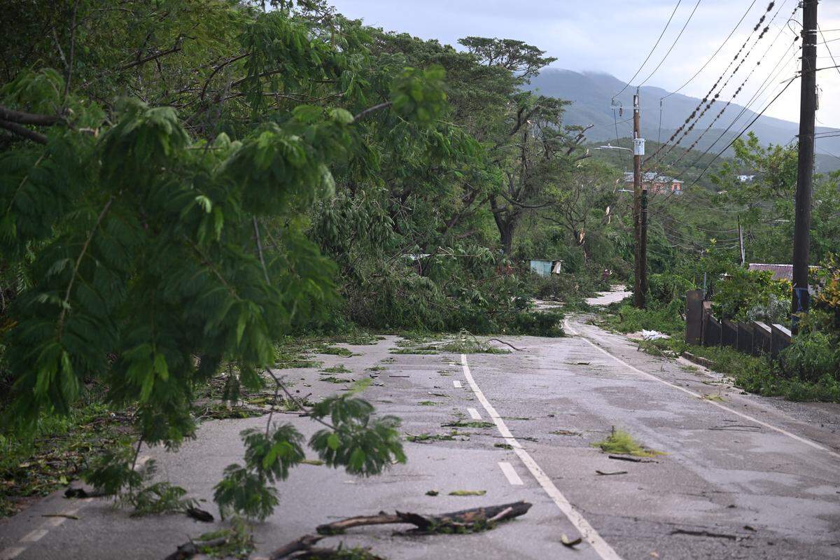 Hurricane Melissa ripped up trees and knocked out power after making landfall in Jamaica on October 29, 2025 as one of the most powerful hurricanes on record, inundating the island nation with rains that threaten flash floods and landslides. 
