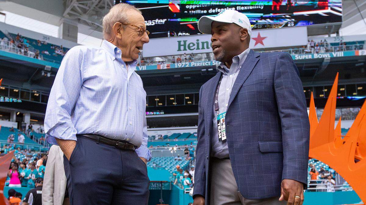 Miami Dolphins owner Stephen Ross talks with Dolphins general manager Chris Grier before the start of their NFL game against the Arizona Cardinals at Hard Rock Stadium on Sunday, Oct. 27, 2024, in Miami Gardens, Fla.