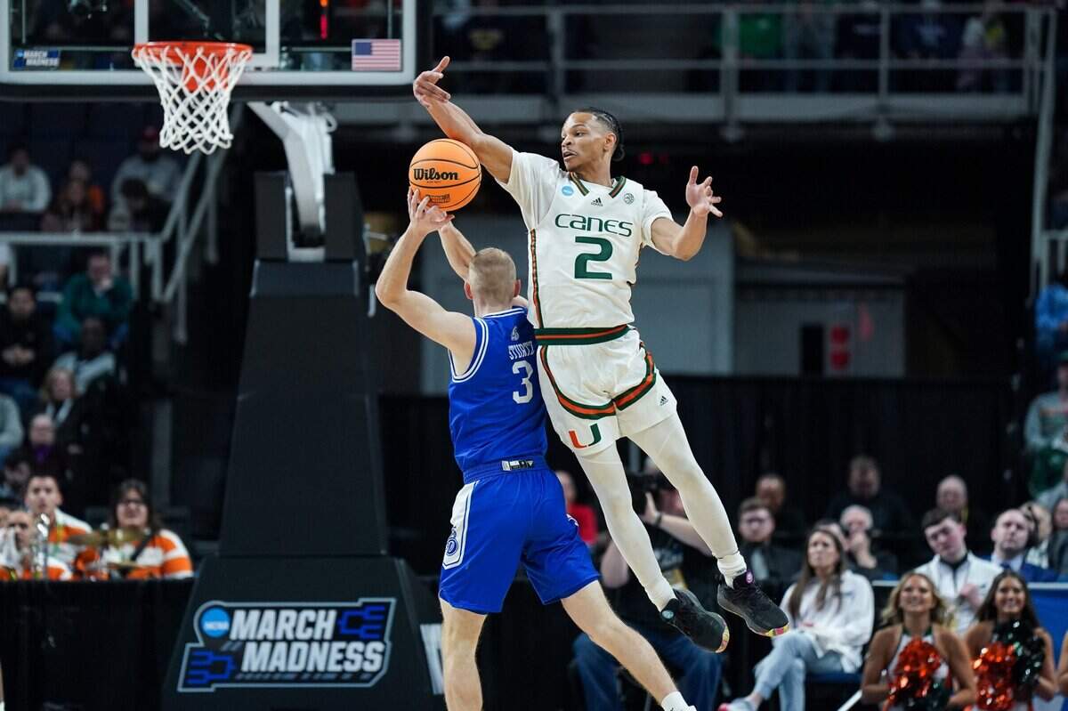 Miami Hurricanes guard Isaiah Wong (2) defends against Drake Bulldogs guard Garrett Sturtz (3) in MVP Arena on Friday in Albany, N.Y. 