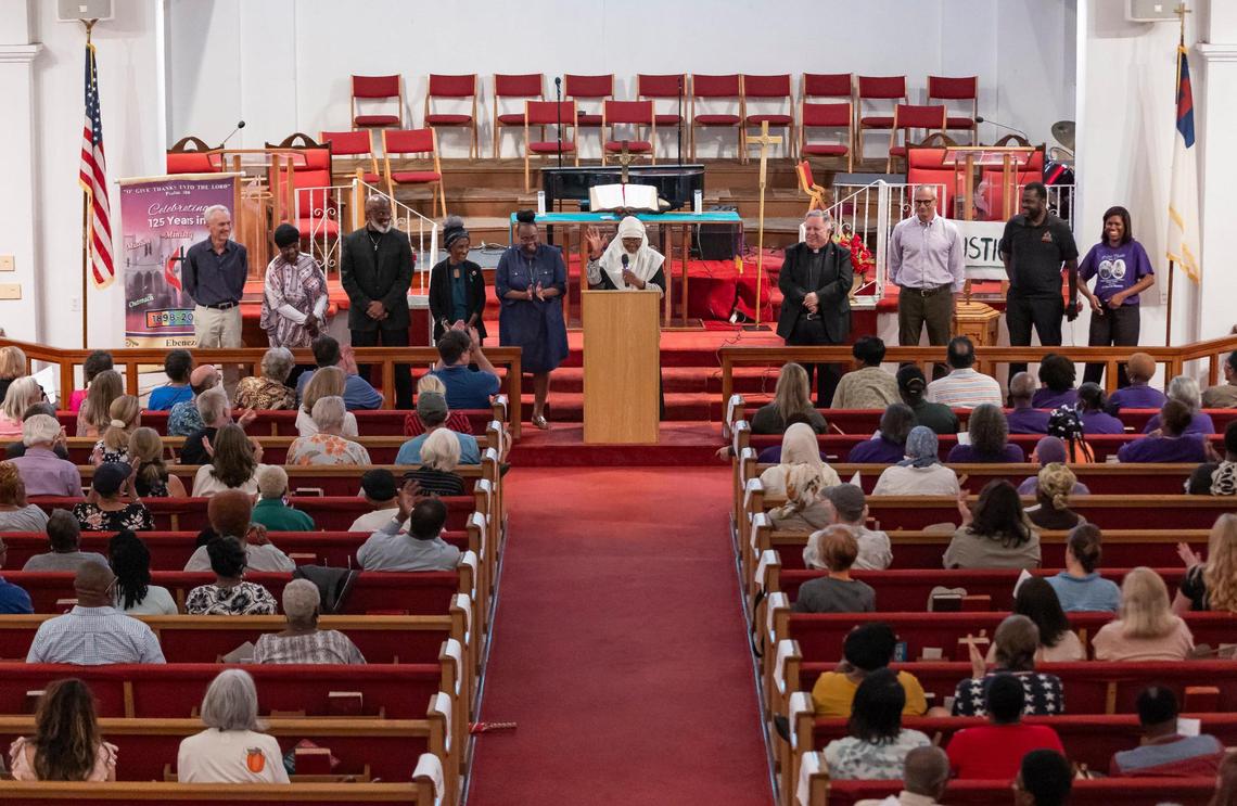 Patricia Salahuddin introduces the newly elected executive board members of the interfaith nonprofit People Acting for Community Together (PACT) during their annual assembly meeting at the Ebenezer United Methodist Church. PACT’s goal is to hold Miami’s public officials accountable through grassroots organizing.
