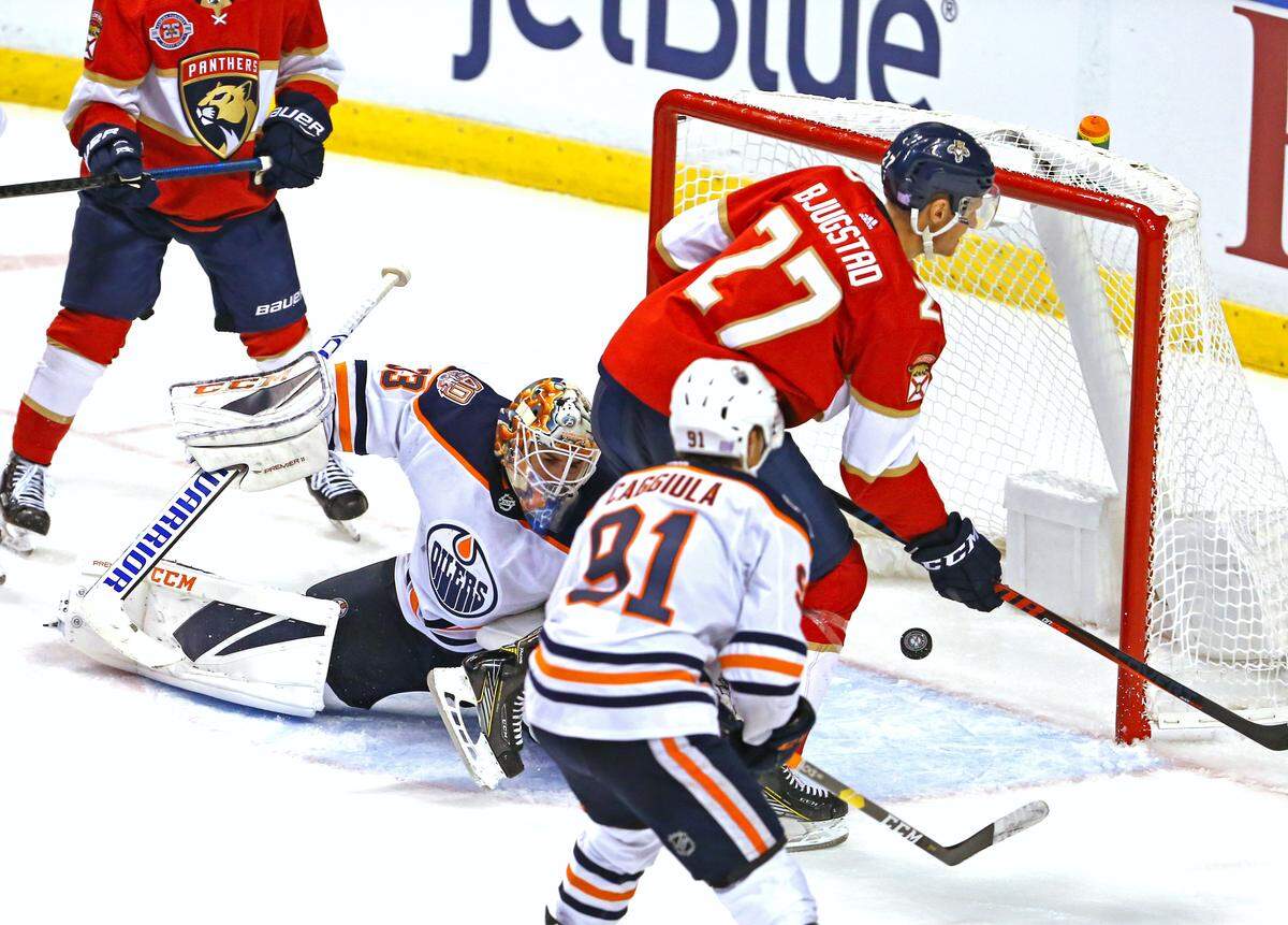 Florida Panthers center Nick Bjugstad (27) scores a goal against the Edmonton Oilers goalie Cam Talbot (33) during the second period of an NHL regular season hockey game at the BB&T Center on Thursday, November 8, 2018 in Sunrise.
