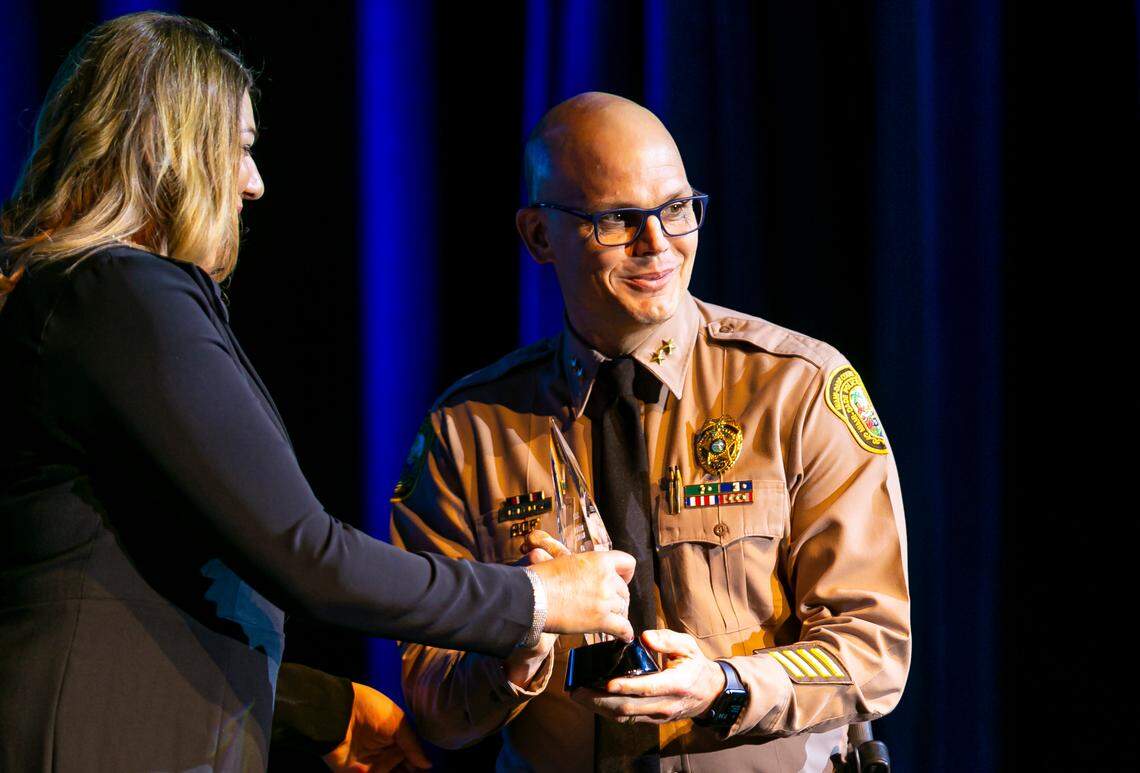 South Operations Division Chief for the Miami-Dade Police Department Brian Rafky is honored by Miami Dade College President Madeline Pumariega during the 2021 Alumni Hall of Fame Ceremony at MDC’s Wolfson Campus in downtown Miami on Wednesday, June 9, 2021. MDC recognized ten alumni on the frontlines of the coronavirus pandemic in a special heroes edition of the annual Alumni Hall of Fame induction ceremony.
